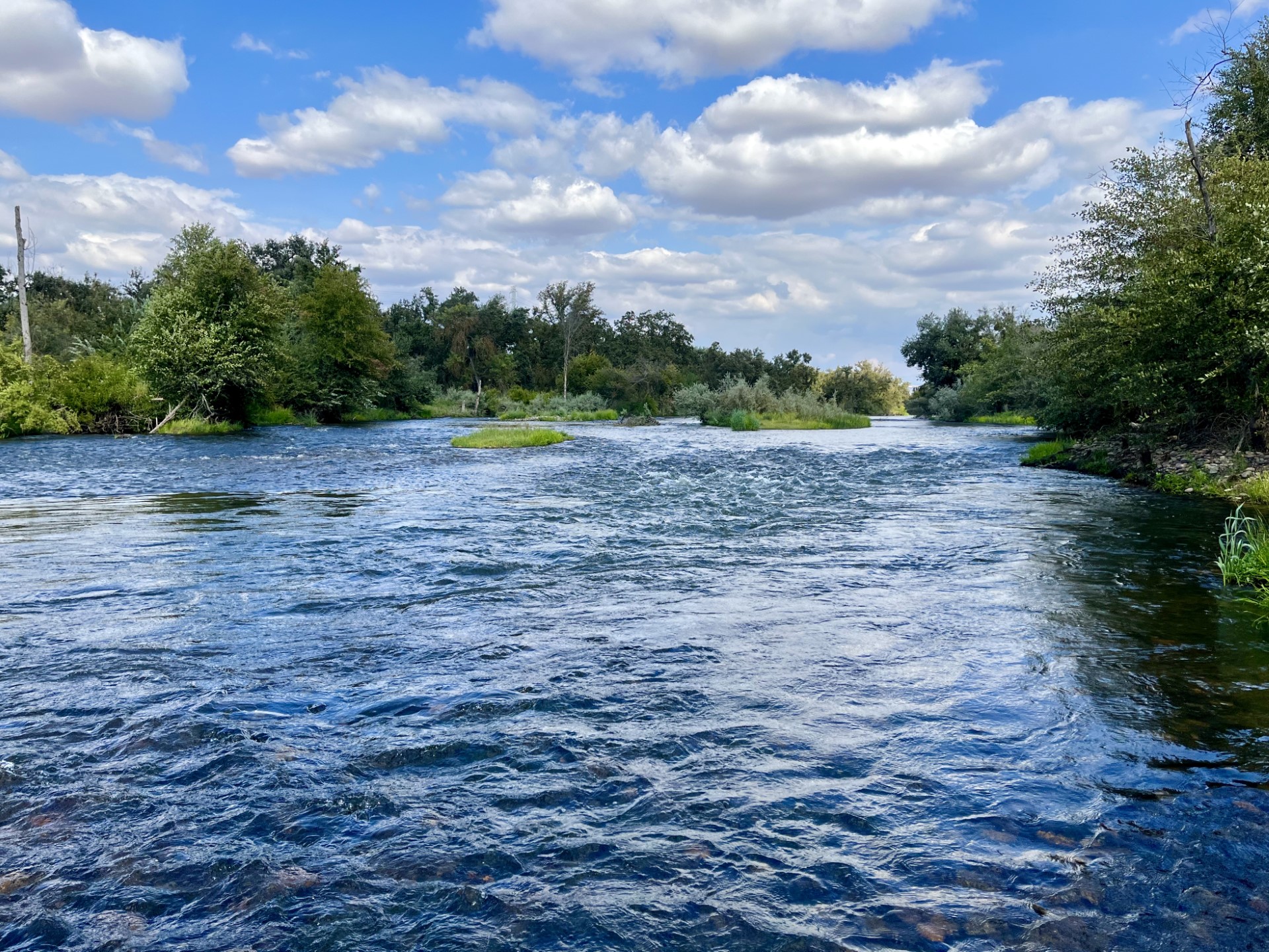 A scenic river-level view of the San Joaquin River